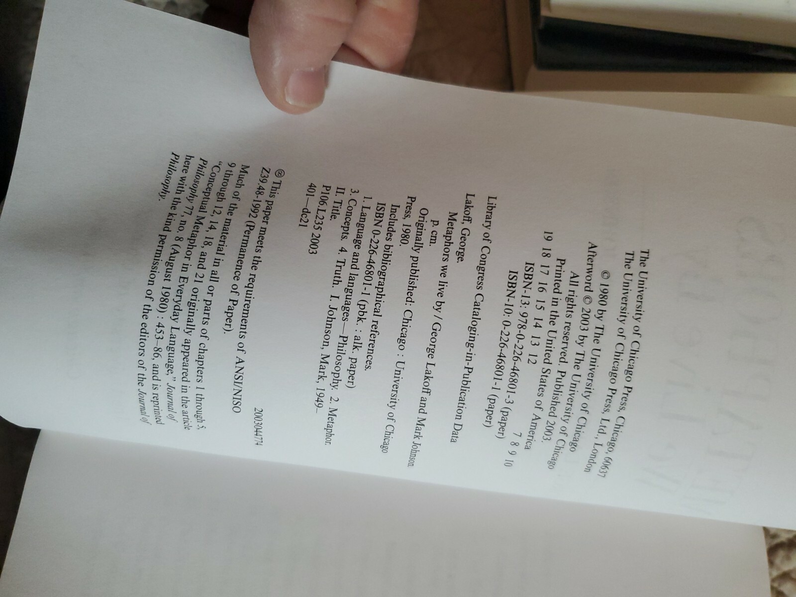 Metaphors We Live By by George Lakoff; Mark Johnson